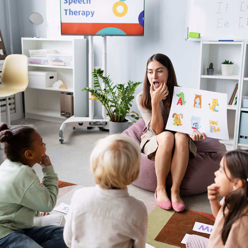 Daycare_0002_young-woman-doing-speech-therapy-with-kids